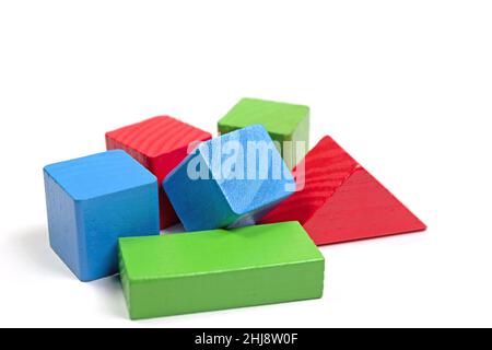 Wooden building blocks against a white background Stock Photo