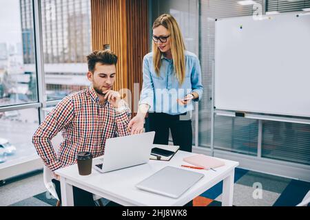 Colleagues discussing new project in office Stock Photo