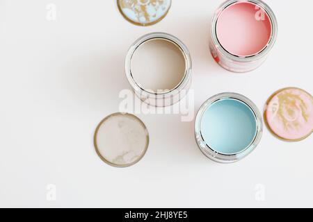 Top view of open paint tin cans on white background. Stock Photo