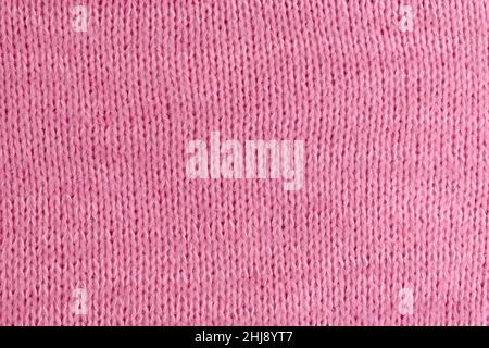 Soft pink woolen knitted textured cloth background mockup, copy space Stock Photo