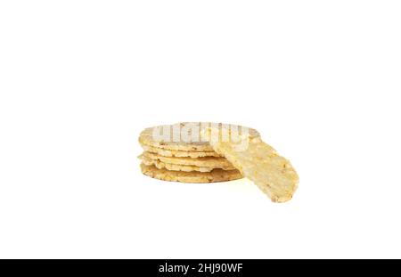 Cornbread, half a breadcrumbs on a stack of whole cornbreads. Healthy food. Stock Photo