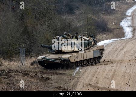 Hohenfels, Germany. 27th Jan, 2022. An M1 Abrams main battle tank drives during the international military exercise 'Allied Spirit 2022' at the Hohenfels training area. With helicopters, tanks and infantry, military forces from more than ten countries are currently training for emergencies at a training area. Credit: Armin Weigel/dpa/Alamy Live News Stock Photo