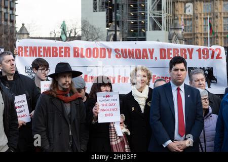 Attendees seen gathering in front of a banner that says 'remember bloody sunday, derry 1972' during the vigil.30th January this year marks the 50th Anniversary of Bloody Sunday, a civil disobedience uprising that took place at Londonderry in 1972. 13 victims were killed by members of the Parachute Regiment. In July 2021, the UK government proposed plans to offer Amnesty for soldiers involved in conflict-related offences, which if effective, will mean that soldiers involved in Bloody Sunday killings will not have to face legal consequences. A vigil was set up in London ahead of the anniversary