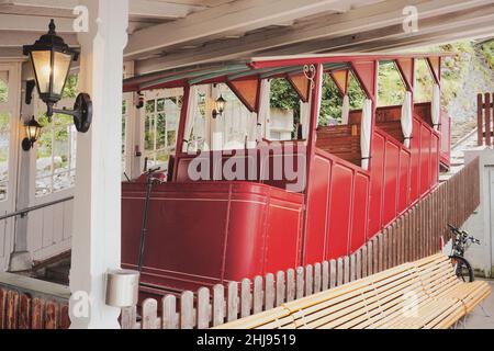 Reichenbachfall Funicular in Willigen near Meiringen, canton of Berne, Switzerland. Historic red cable car transport to the famous Reichenbach Falls. Stock Photo