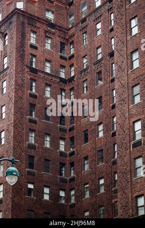 Red brick building typical of New York streets, NYC Stock Photo