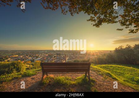 Bench and Pietrasanta panoramic view from Rocca di Sala fortress at sunset. Versilia Lucca, Tuscany region, Italy, Europe Stock Photo