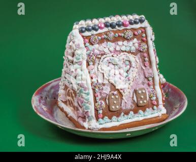 Traditional ginger bread house on a plate Stock Photo