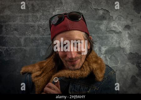 Bearded man portrait near old color stone brick wall Stock Photo