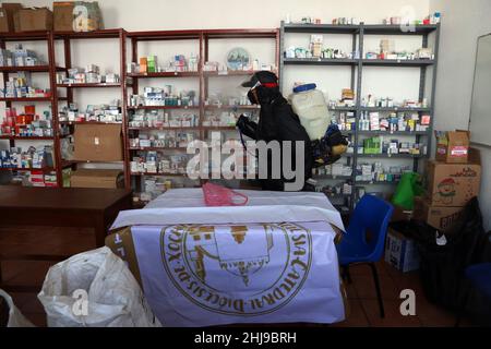 Sanitizer Daniela Guerrero  sprays disinfectant in medical office as attempt to avoid the increase in infections by the new Omicron variant of the Cov Stock Photo