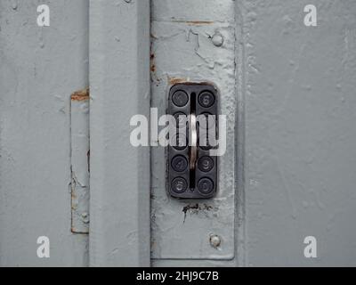 Secure password on keyboard for opening house door. Old system of protect and safe in the past. Vintage combination lock with buttons on the grey Stock Photo