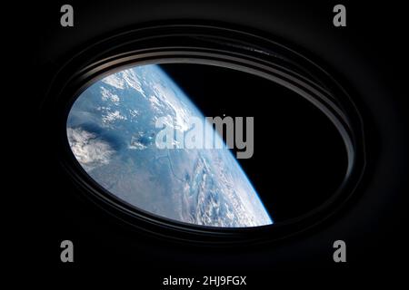 View from the window of the SpaceX Crew Dragon vehicle when it undocked from the International Space Station as part of the SpaceX Demo-2 mission.  Photograph taken in low orbit on 2 August 2020 over Kazakhstan showing moon beyond. Stock Photo