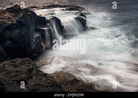 Long exposure of lava rock pools on tenerife Stock Photo