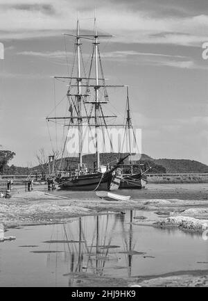 The image is of the replica theme park  of Old Sydney Town as it was in the 17th century being a popular tourist attraction, with this image showing the tall coastal merchant ships Stock Photo