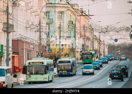 Gomel, Belarus. Traffic On Sovetskaya Street In Gomel, Belarus. Colorful Trolleybuses Moving On City Center. Stock Photo