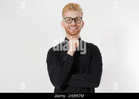 Happy Stylish guy in black shirt and glasses. Folded arms, copy space. Successful young, Entrepreneur concept. Redheaded man with red beard. Start up, Stock Photo