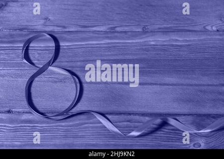 March 8th. International Women's Day concept. Figure eight made out of ribbon.  Stock Photo