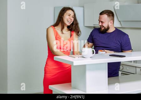 Colleagues are chatting during break in office kitchen. Stock Photo