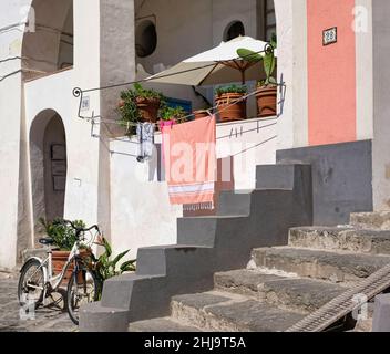 Colored walls and bike in Procida, a little island in Campania, southern Italy Stock Photo