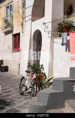 Colored walls and bike in Procida, a little island in Campania, southern Italy Stock Photo