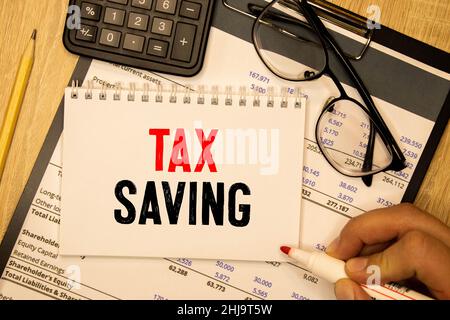 Conceptual hand writing text caption inspiration showing Tex Savings . Business concept for Tax Savings Extra Money Refund written on sticky note pape Stock Photo
