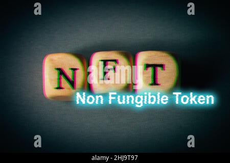 NFT non fungible token - text with glitch effect. Modern business crypto art and digital currency concept. Stock Photo