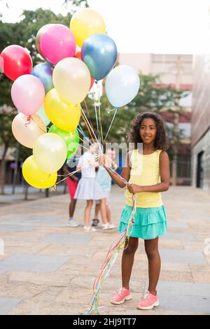 Happy african american preteen girl watching cartoons online Stock ...