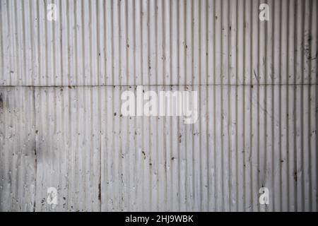 A sheet of real old aluminum metal wall background texture Stock Photo