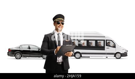 Chauffeur with a clipboard standing in front of a mini bus shuttel and a black car isolated on white background Stock Photo