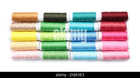 Multicolored sewing thread spools on white background Stock Photo