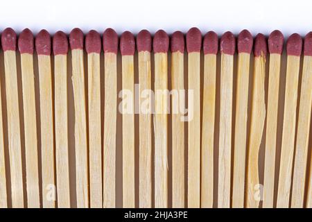 Row of match sticks on a white background Stock Photo