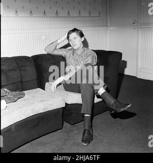 Roy Tempest, Theatrical Agent, London, 15th November 1964. Pictured at his flat in Upper Wimpole Street, Marylebone, London. He alleges that he was beaten up by a group of waiters and kitchen staff carrying meat cleavers and truncheons after being refused service for not wearing a  tie. Stock Photo