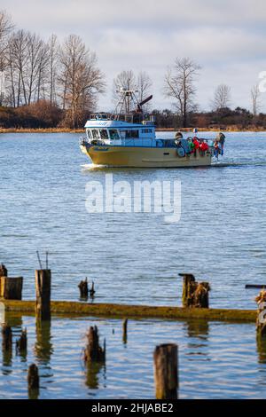 Commercial fishing vessel returning from the Salish Sea to Steveston British Columbia Canada Stock Photo