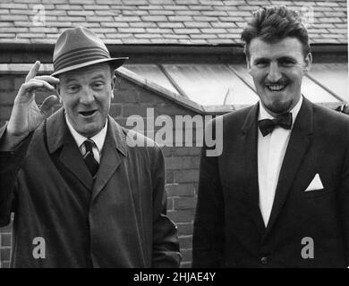 Stan Cullis (left) former manager of Wolverhampton Wanderers pictured arriving with Jimmy Hill manager of Coventry City at Highfield Road for league match bewteen Coventry City and Northampton September 1964. Final score: Coventry City 0-1 Northampton Stock Photo