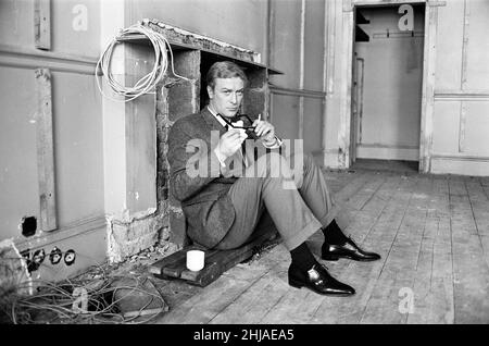 Michael Caine on the set of 'The Ipcress File'. 21st September 1964. Stock Photo