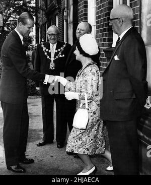 Prince Philip, Duke of Edinburgh shakes hands with the Mayoress of Leigh on his arrival at Leigh Boys Grammar School. Pictured also are the Mayor of Leigh (Alderman S. Jones), the Town Clark of Leigh (Mr Albert Jone) and the Chairman of the Lancashire Education Committee (County Alderman J.R. Hull). 14th June 1963. Stock Photo