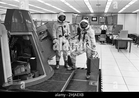 Astronauts Edwin Eugene Buzz Aldrin (left) and Theodore Cordy Ted Freeman (right) seen here at the Johnson Space Centre in Houston, Texas, with a Gemini  space capsule.  30th October 1964Astronaut Ted Freeman sadly died in an aircraft accident the day after this image was captured Stock Photo
