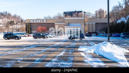 Cars parked in the snow covered parking lot in front of the Kohl's Department Store in Monroeville, Pennsylvania, USA Stock Photo