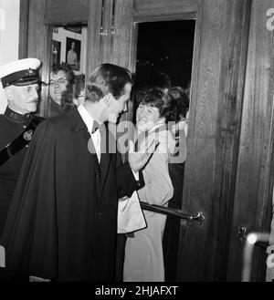 The world premier of  'The Main Attraction' at the Plaza, Piccadilly, which stars Pat Boone and Nancy Kwan. Pictured, Pat Boone waving to fans through the door of the theatre. 25th October 1962. Stock Photo