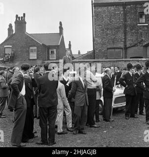 Sir Oswald Mosley visits Manchester to take part in a march organised by his British Union of Fascists supporters, Sunday 29th July 1962. When the eighty marchers gathered, an angry crowd rushed them and Mosley disappeared into a flurry of flying fists and boots and his groups banners were torn to tatters.  Police broke up the fighting mob and rescued 65-year-old Mosley but the march soon turned into a riot causing a mile of terror with fights breaking out every few yards. Many marchers fell out with bleeding faces and torn clothes. The rest were pelted with stones, coins, cabbages, tomatoes a Stock Photo