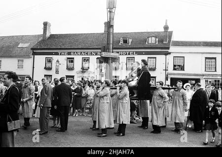 Dunmow Flitch procession through the streets of Dunmow, Essex. Dunmow holds a four-yearly ritual of the 'Flitch Trials', in which couples must convince a jury of six local bachelors and six local maidens that, for a year and a day, they have never wished themselves unwed. 11th July 1963. Stock Photo