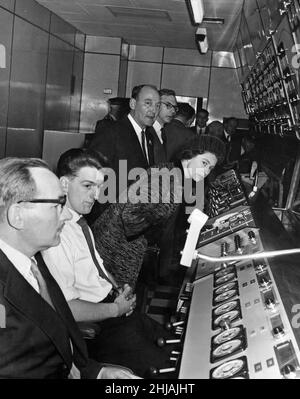 The Queen looks out from the control room at Spencer Works and watches an ingot being rolled through the Cold Rolling Mill. 26th October 1962. Stock Photo