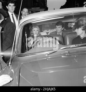 Brigitte Bardot (30) in Hampstead, London to complete a few finishing scenes for her new film Adorable Idiot.   Pictured sitting in back seat of car, in Flask Walk, a small Hampstead street, 25th October 1963.   *** Local Caption *** Brigitte Bardot plays character Penelope Lightfeather Stock Photo