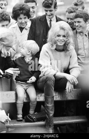 Brigitte Bardot (30) in Hampstead, London to complete a few finishing scenes for her new film Adorable Idiot, where she plays character Penelope Lightfeather.  Pictured surrounded by fans & admirers in Flask Walk, a small Hampstead street, 25th October 1963. Stock Photo
