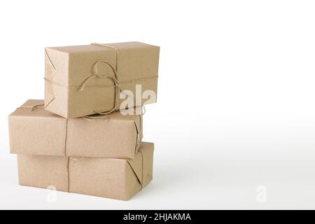 Three packages packed with wrapping paper on a white background Stock Photo