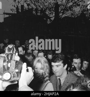 Brigitte Bardot (30) in Hampstead, London to complete a few finishing scenes for her new film Adorable Idiot.   Pictured surrounded by fans & admirers in Flask Walk, a small Hampstead street, 25th October 1963.   *** Local Caption *** Brigitte Bardot plays character Penelope Lightfeather Stock Photo
