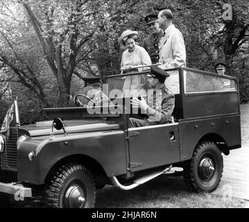 Queen Elizabeth II and the Duke of Edinburgh visit Wales. Pictured, the Queen and the Duke share a joke  in the back of an open Land-Rover with the officers accompanying them on a field car tour of the Welsh Brigade Depot at Cwrt-y-Gollen. 10th May 1963. Stock Photo