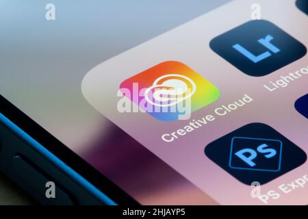 Adobe Creative Cloud, Lightroom and PS Express apps are seen on an iPhone. Adobe Creative Cloud is a set of applications and services from Adobe Inc. Stock Photo