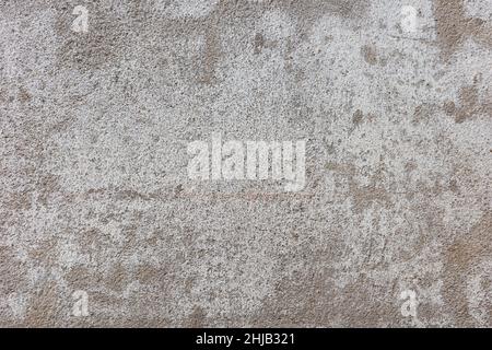 Close up on rough texture of white surface background on cement wall outside old building. Stock Photo