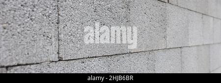 Gray concrete wall made of rectangular blocks Stock Photo