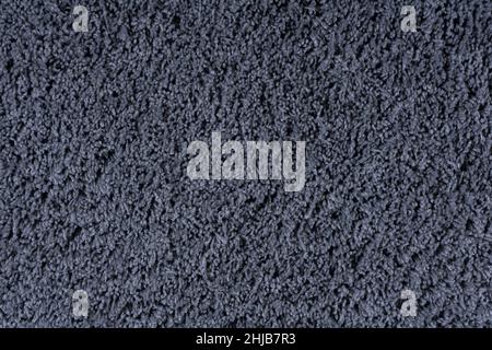 Carpet texture background. Black gray cotton carpet for floor coverings. Material for interior design and decoration of living rooms. High quality photo Stock Photo